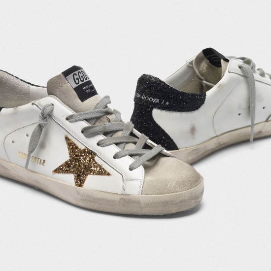 Women Golden Goose superstar sneakers with gold star and glittery black
